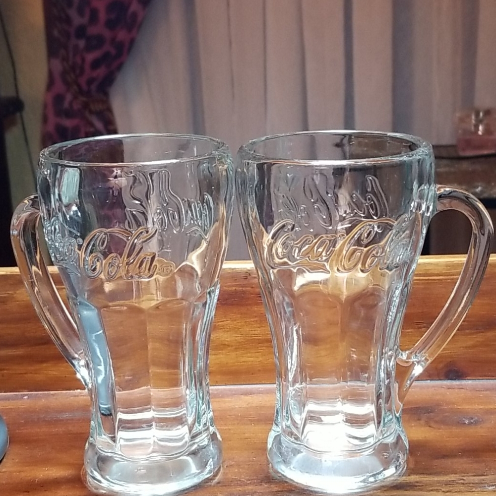 Two Coke mugs of clear glass